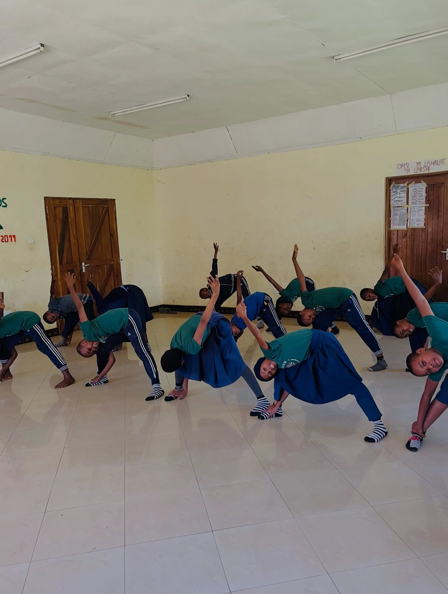 Children practicing dance moves during a workshop